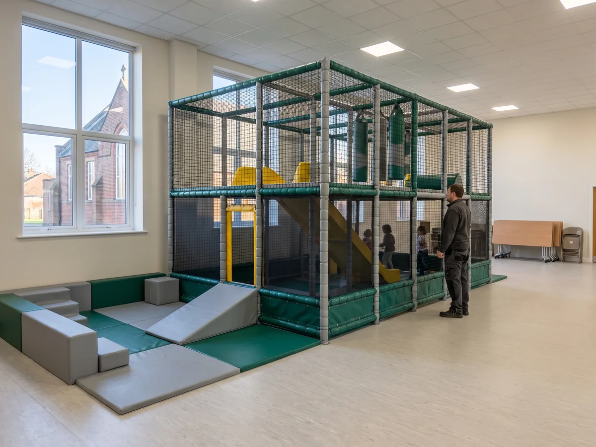 Fixed two-level soft play structure and a toddler corner in a church children’s room