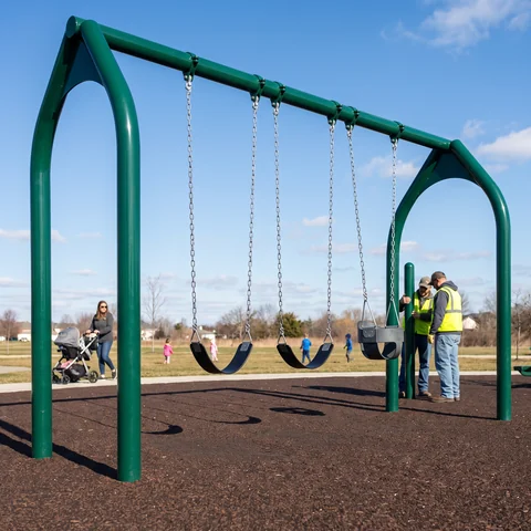 Commercial swing set with belt seats and a toddler bucket seat