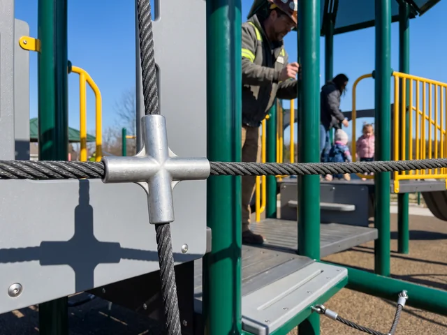 A pressed aluminum connector joining steel-core polyester climbing ropes