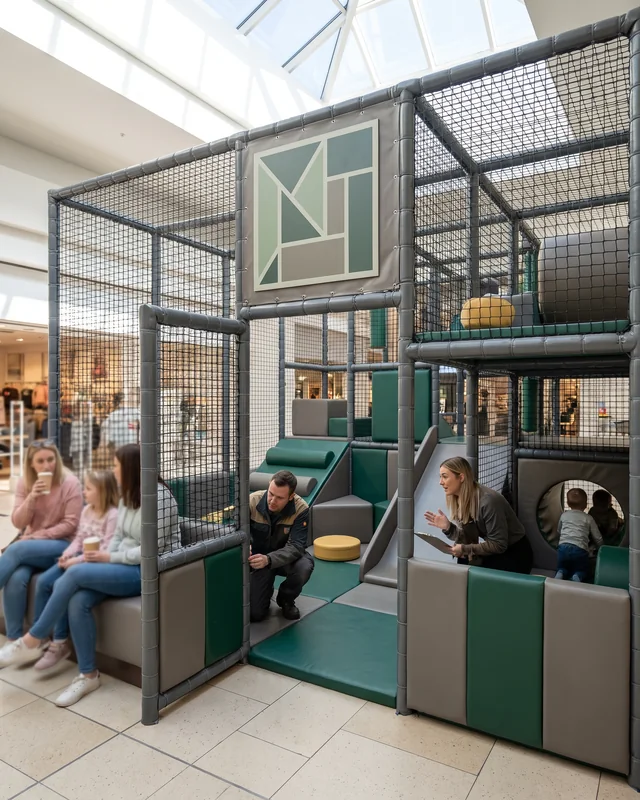 A compact branded soft play area in a mall corner