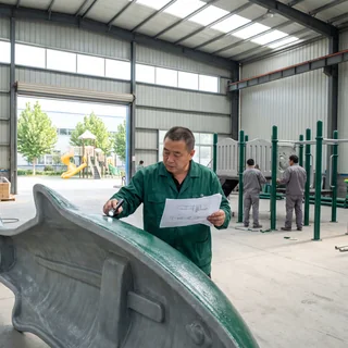QC checking a partner-built fiberglass figure before loading