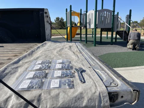 A spare hardware kit laid out on a tailgate