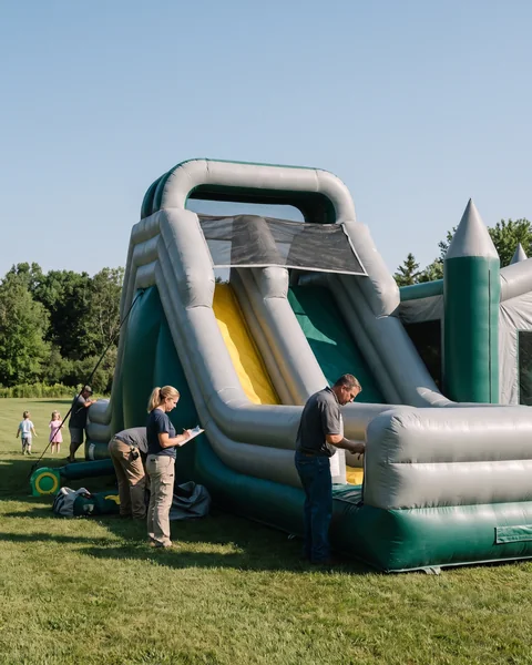 A commercial inflatable play unit on a lawn