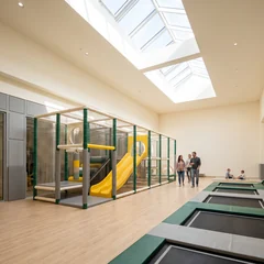 Outdoor commercial play structure beside a venue