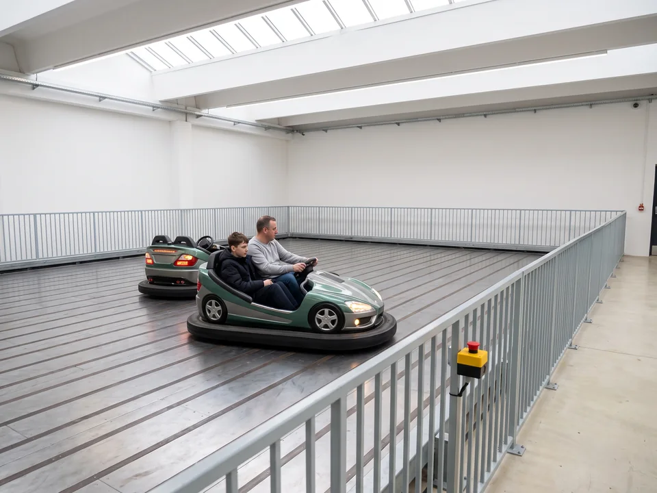 Bumper cars driving on floor-grid plates in a fixed arena