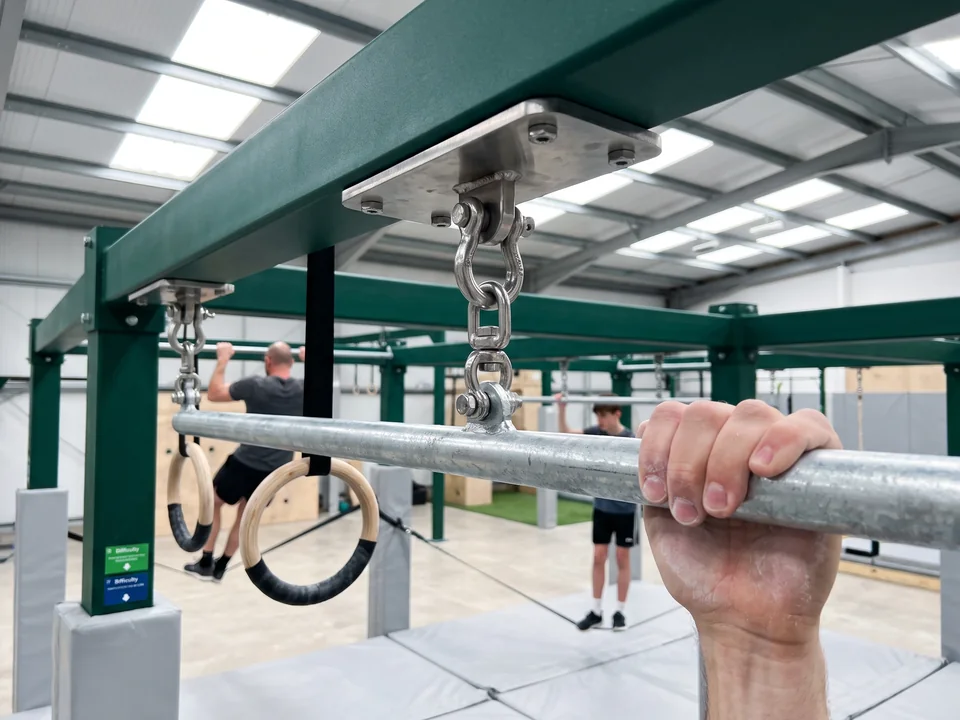 A stainless shackle and swivel under a hang plate on the rig beam