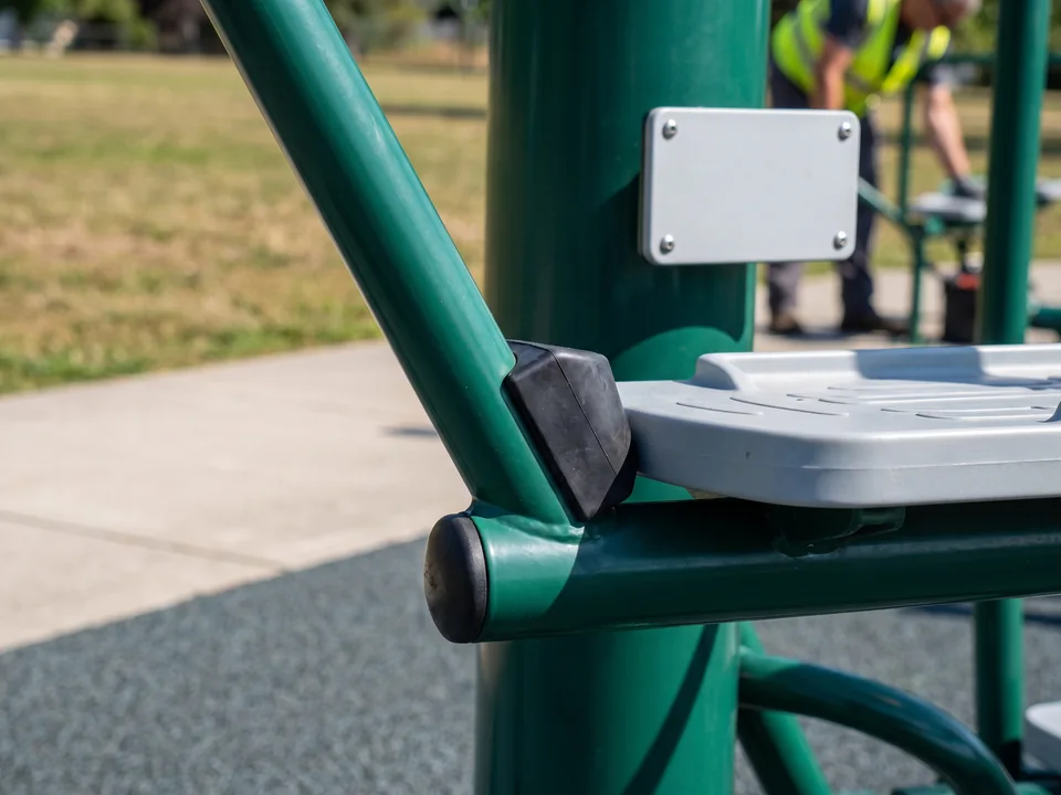 The foot arm of an air walker resting on its rubber bumper