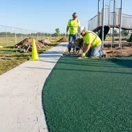 The edge of the poured surfacing meeting the path