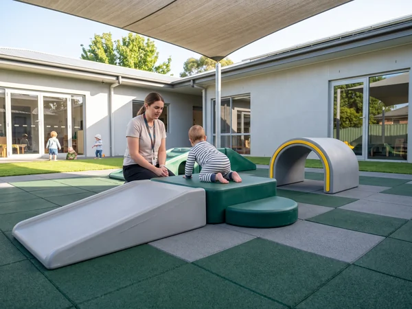 Low crawl and climb pieces for a 6–23 month infant area