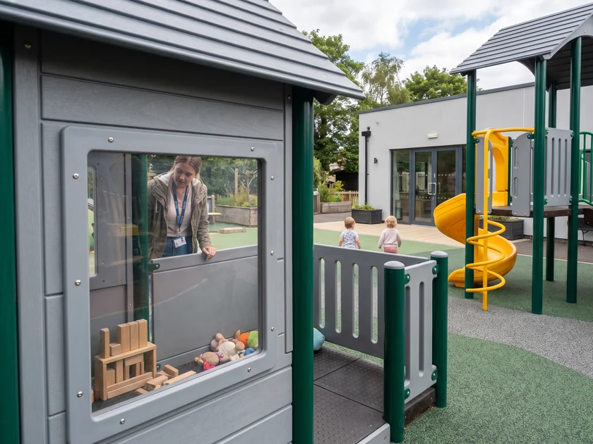 Clear polycarbonate window panel in a playhouse wall