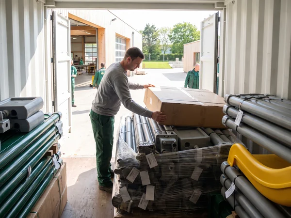 Numbered parts loaded in a container