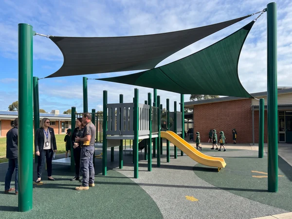 Steel-frame shade sails over a play area