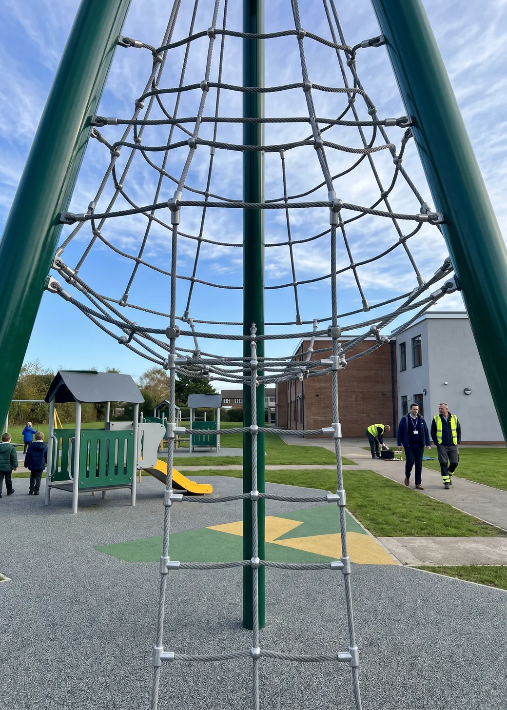 A tall rope climbing structure with steel-core rope and aluminum connectors