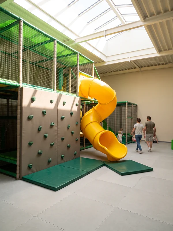 Padded soft climbing wall between two levels
