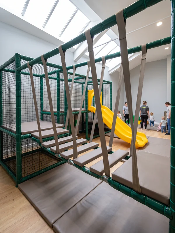 Wobble bridge of padded deck sections