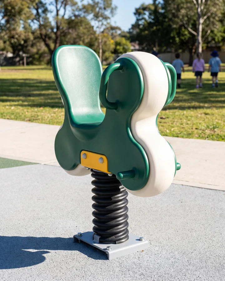 A high-back inclusive spring rider with handles