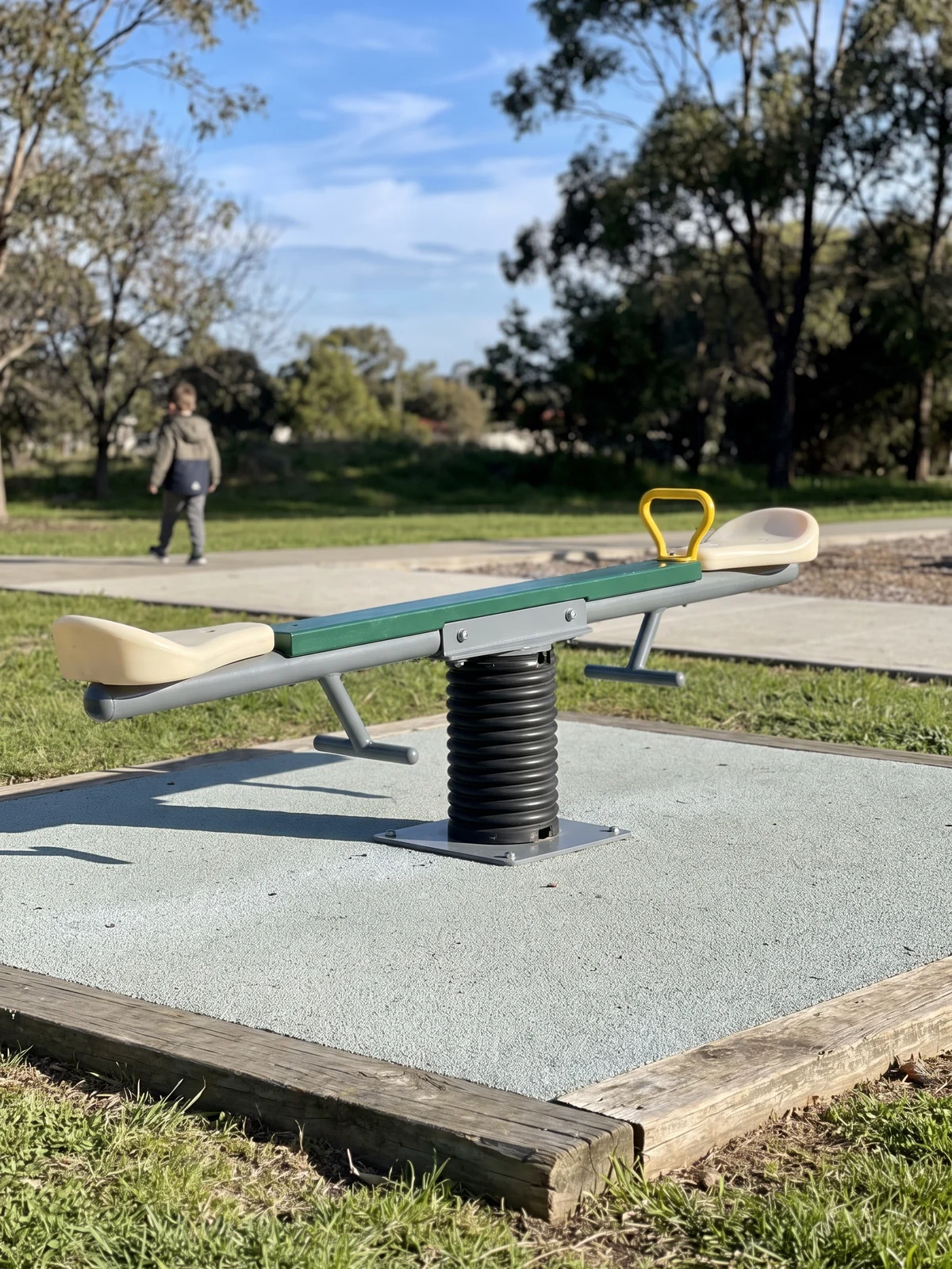 A spring seesaw with a level beam on a sleeved center spring