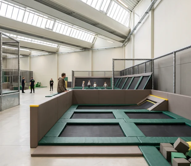 Small kids' trampoline court with low padded walls