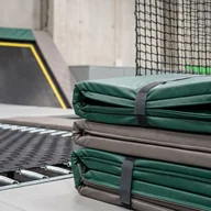 Stack of evergreen and grey PVC-leather frame pads