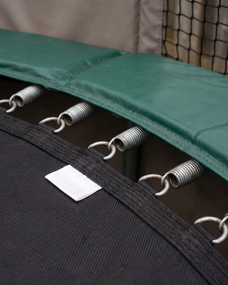 Cell number label T1-014 sewn on a jump bed edge next to the D-rings