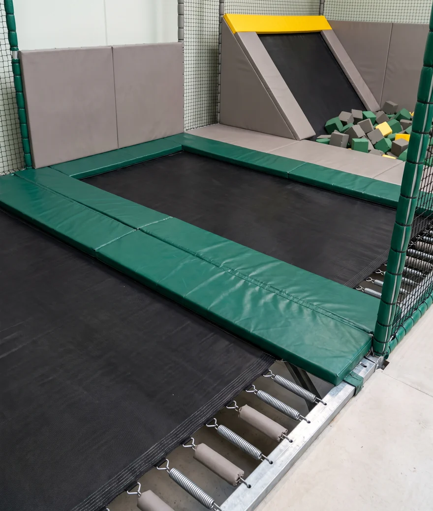 Evergreen frame-top pads covering the rails between jump beds