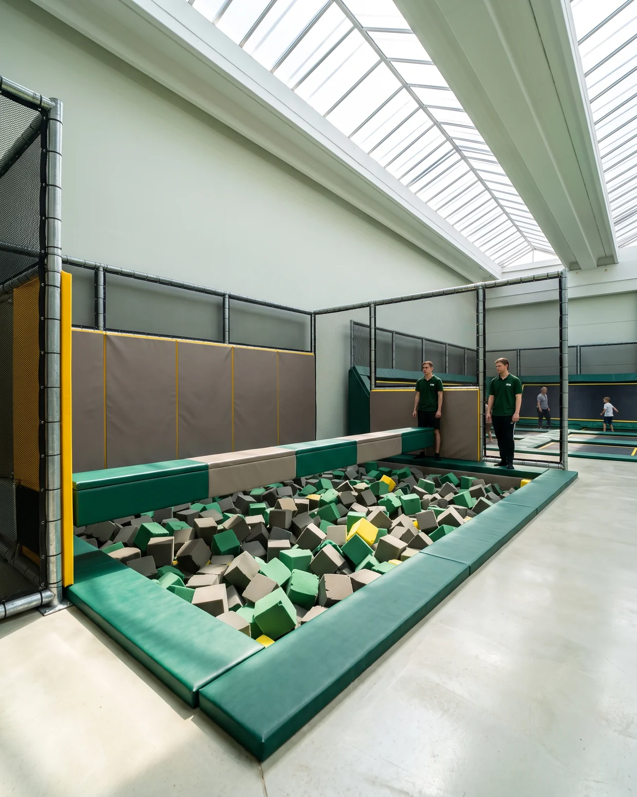 Foam pit with padded walls, edge caps and a battle beam above