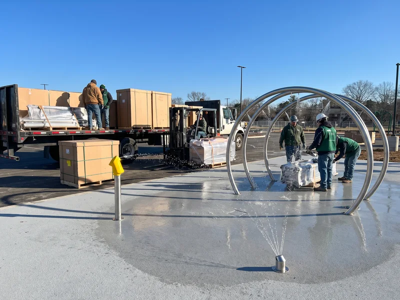 A splash pad with stainless spray features