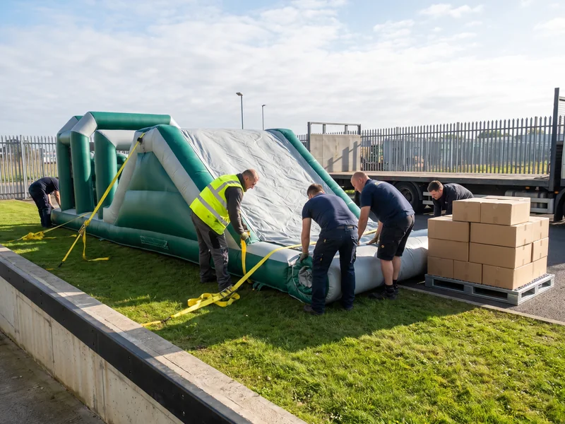 A commercial inflatable obstacle unit set up on grass